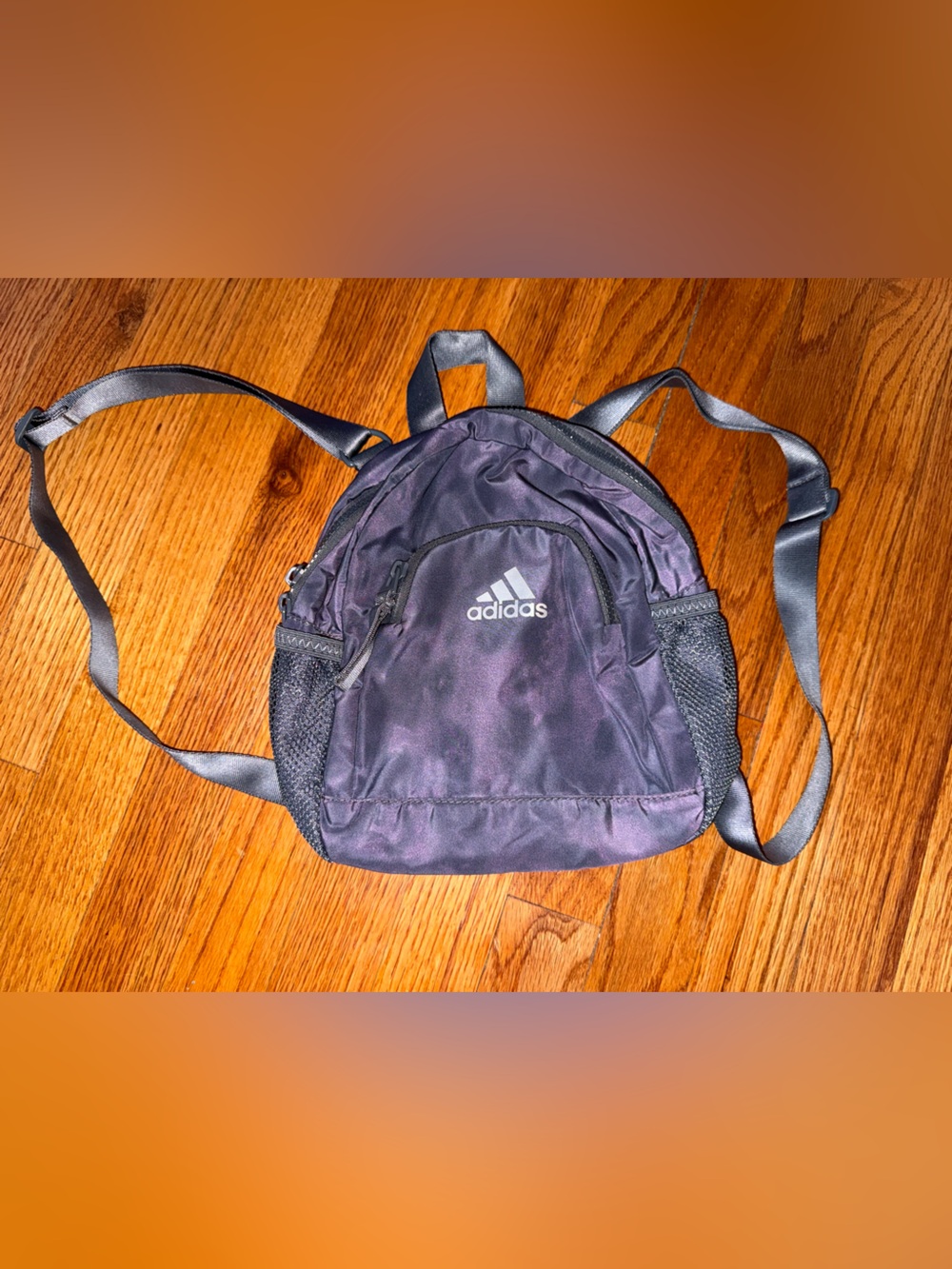 Adidas Linear 3 Mini Backpack in a dark gray or purple colorway